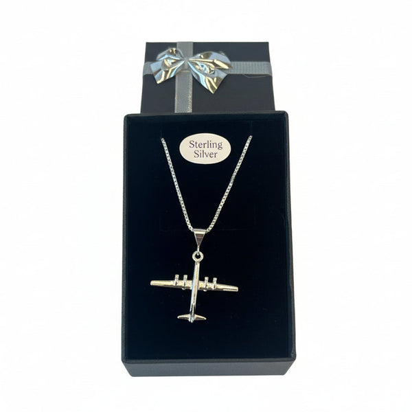 Silver airplane pendant necklace in a black box with 'Sterling Silver' label.