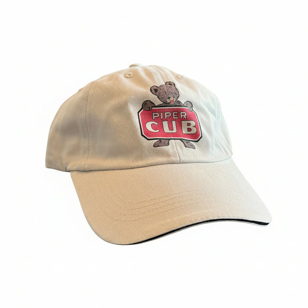 Tan cap with a Piper Cub logo 